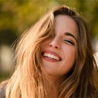 woman smiling after getting dental bridge in Bellingham   