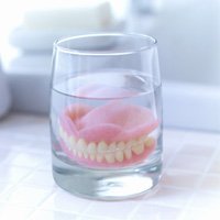 Dentures soaking in solution