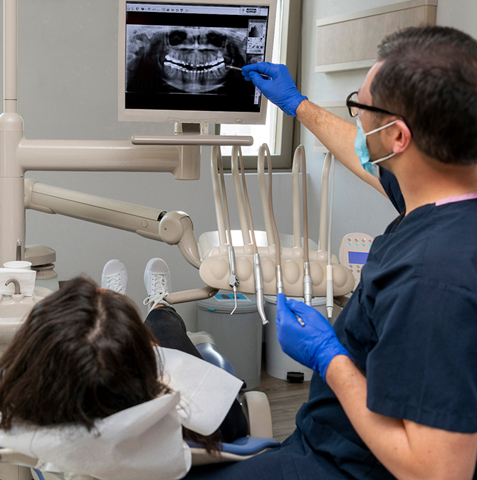 Dentist showing a patient their dental x-rays