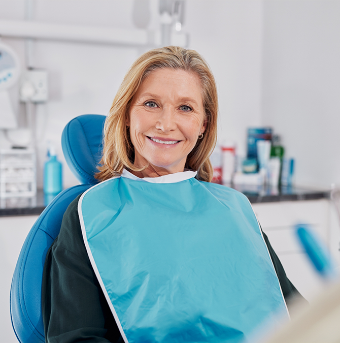Older woman smiling in the dental chair