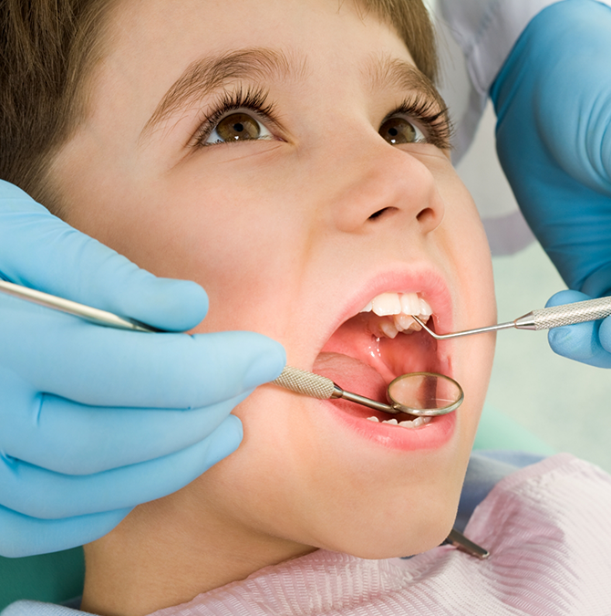 Young boy getting a dental checkup