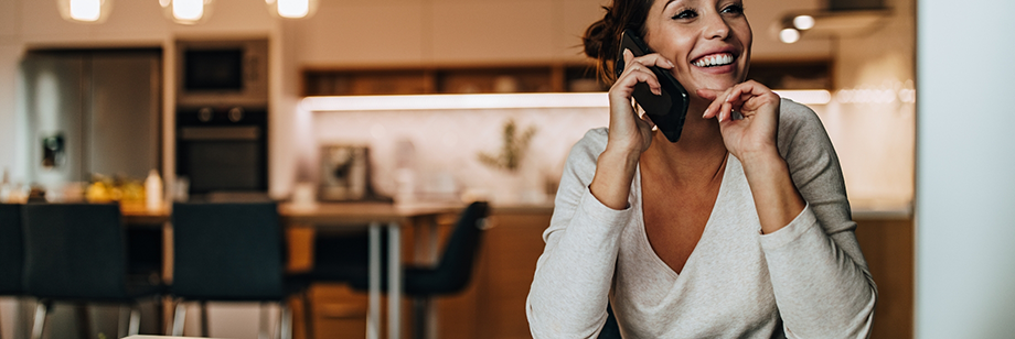 Woman talking on the phone with a dental office in Bellingham