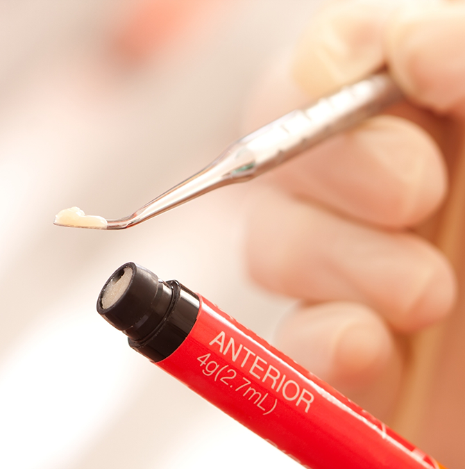Dentist preparing cosmetic bonding material