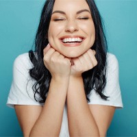 woman smiling after getting dental crowns in Bellingham