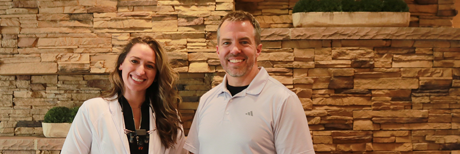 Doctor John Young and Doctor Lindsey Montileaux smiling at Young Dental
