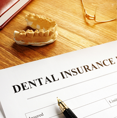 Dental insurance paperwork on a table