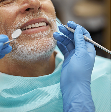 Senior man getting a dental exam