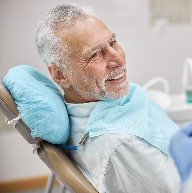 Senior man smiling at his dentist