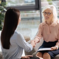 mature woman smiling during job interview