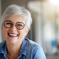 Senior woman with glasses smiling