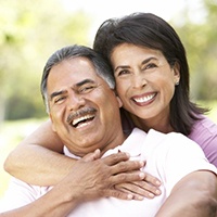 Smiling couple with dentures in Bellingham