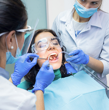 Woman having her mouth examined by her dentist