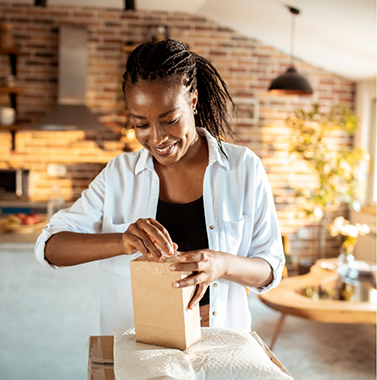 Woman opening a package