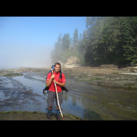 Man standing by river bed