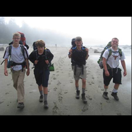 Four teen boys hiking