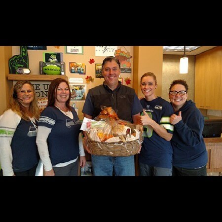 Team members and patient with gift basket