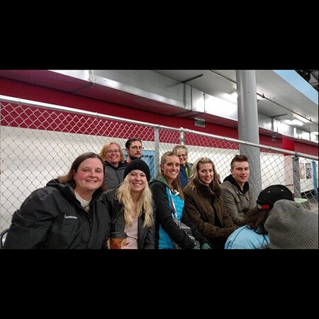 Team members at hockey game