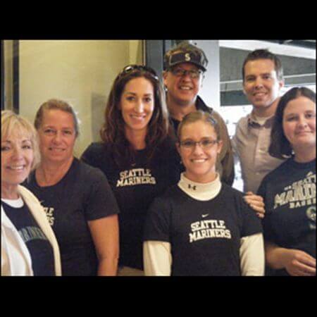 Team members posing at Mariner's game