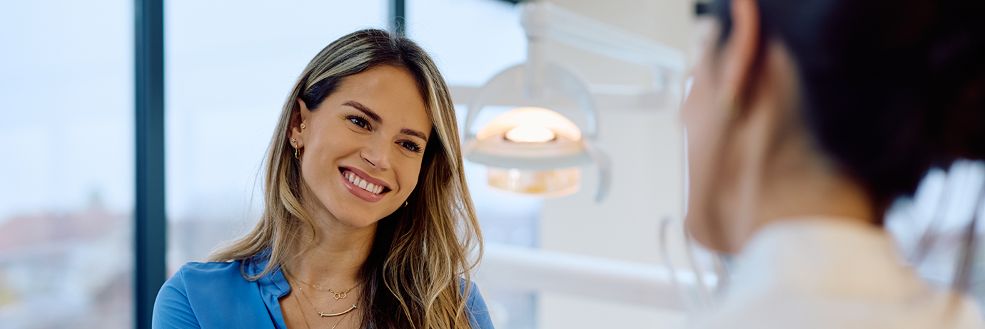 Dental team member smiling at a patient