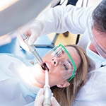 dentist examining a patient’s mouth 