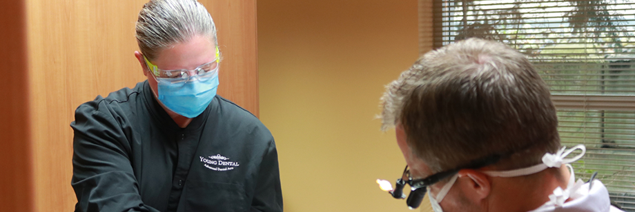 Bellingham dentist and team member treating a patient