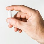 Hand holding pill for oral conscious sedation in Bellingham, WA