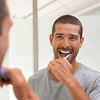 Bellingham patient brushing teeth after gum treatment