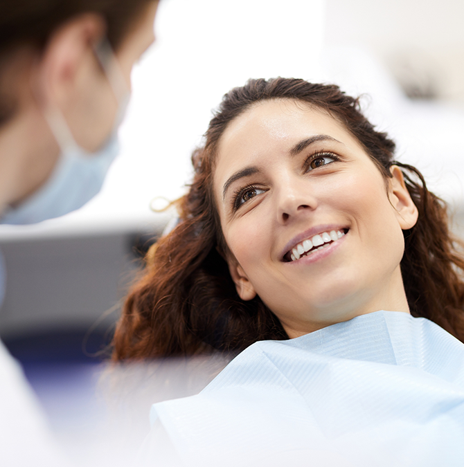 Woman talking with her dentist