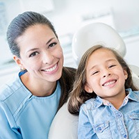 Young girl smiling in dental chair