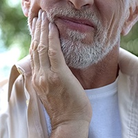A man suffering from a toothache in Bellingham, WA