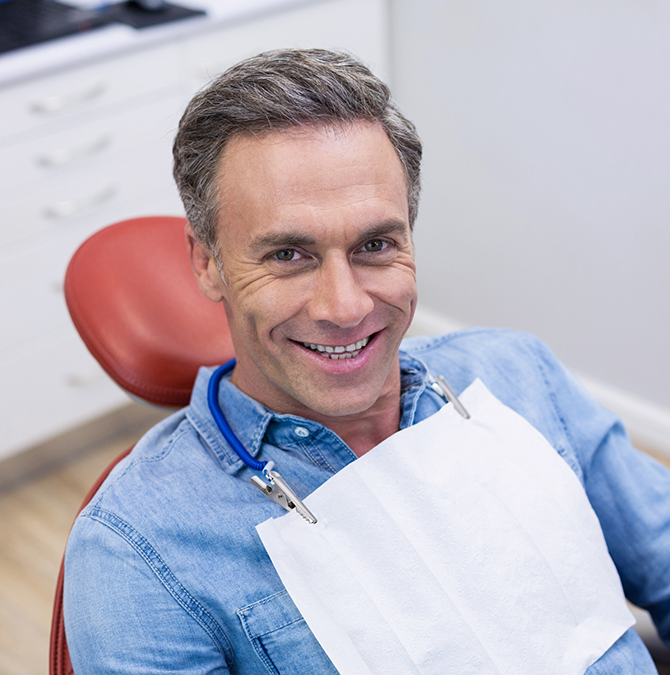 Smiling man in the dental chair