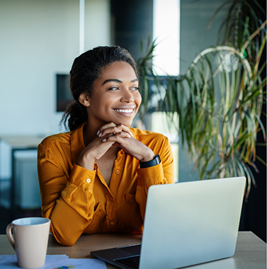 Smiling woman at an office desk