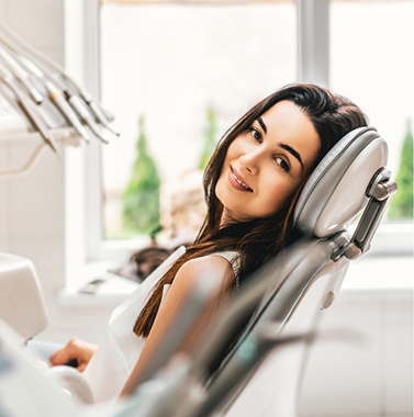 Young woman leaning back in the dental chair