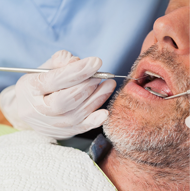 Man receiving a dental treatment