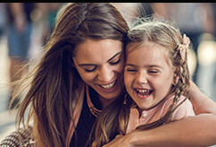 Mother and daughter laughing