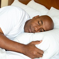 Man sleeping soundly in bed