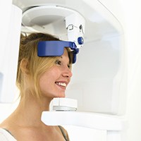 Woman smiling during cone beam scan