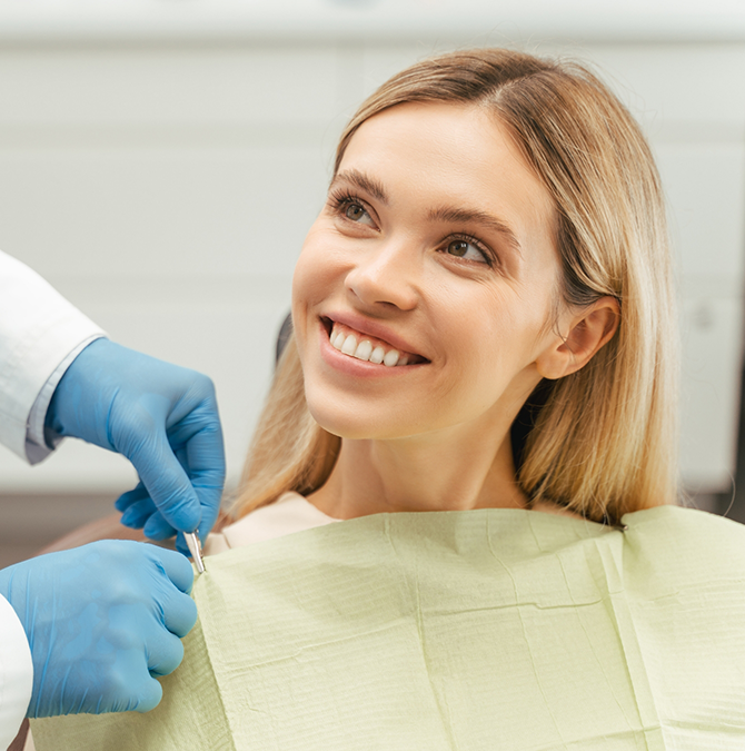 Woman smiling at her dentist