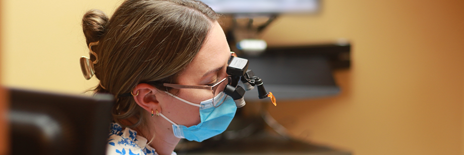 Dentist examining a patient's mouth before performing tooth extractions in Bellingham