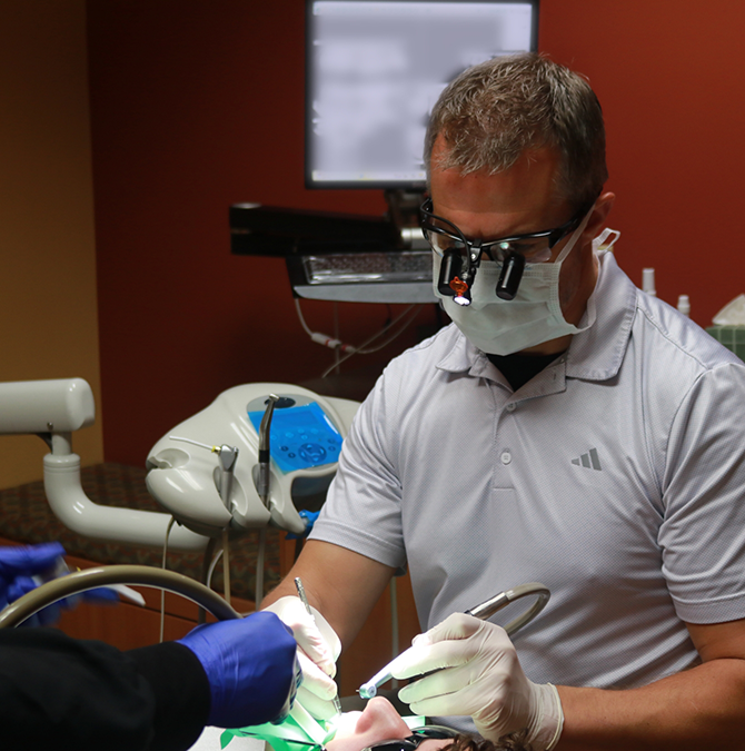 Doctor Young treating a dental patient