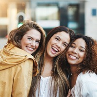 female friends smiling with veneers in Bellingham