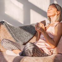 a person relaxing and drinking tea