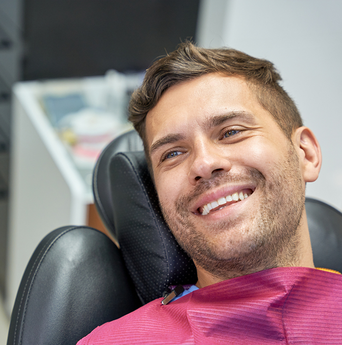 Man smiling at his dentist