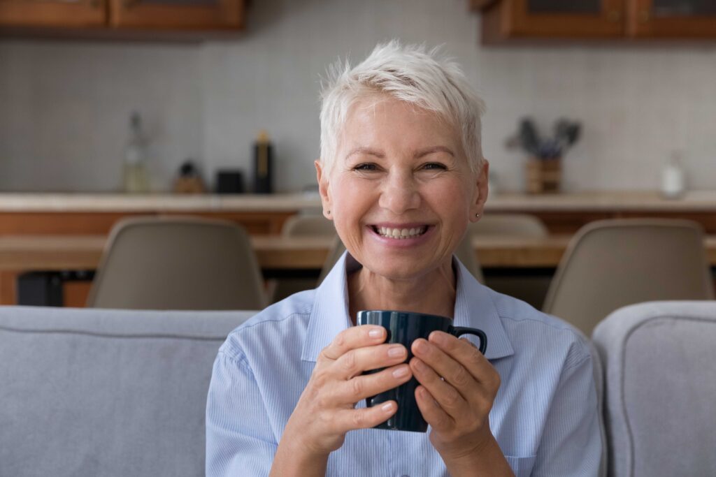 Senior woman smiling on a couch