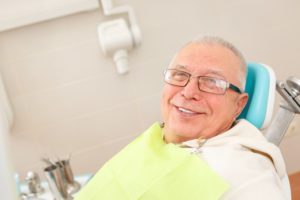 man in dentist chair smiling