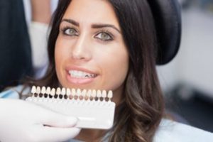 Patient at the dentist to receive porcelain veneers