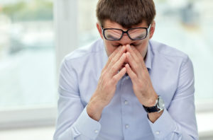 man having trouble staying awake