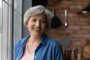 Woman with dentures smiling